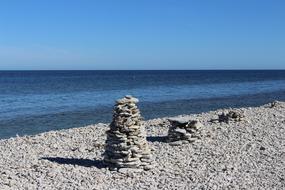 stone tower on the beach by the sea