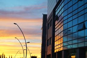 glass building by the sun