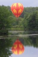 orange balloon by the lake