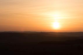 The sun burning in the distance