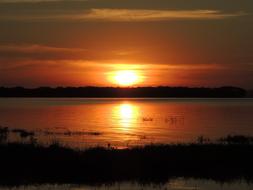 orange sun in the distance