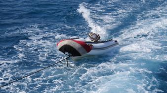 a boat on a rope in the sea