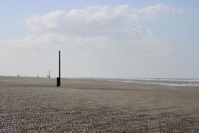 pole on the beach of the sea