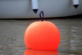 orange buoy by the boat