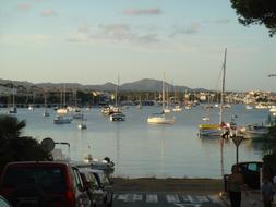 boats by the sea with clouds