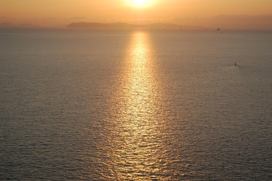 the sea with a sunny road