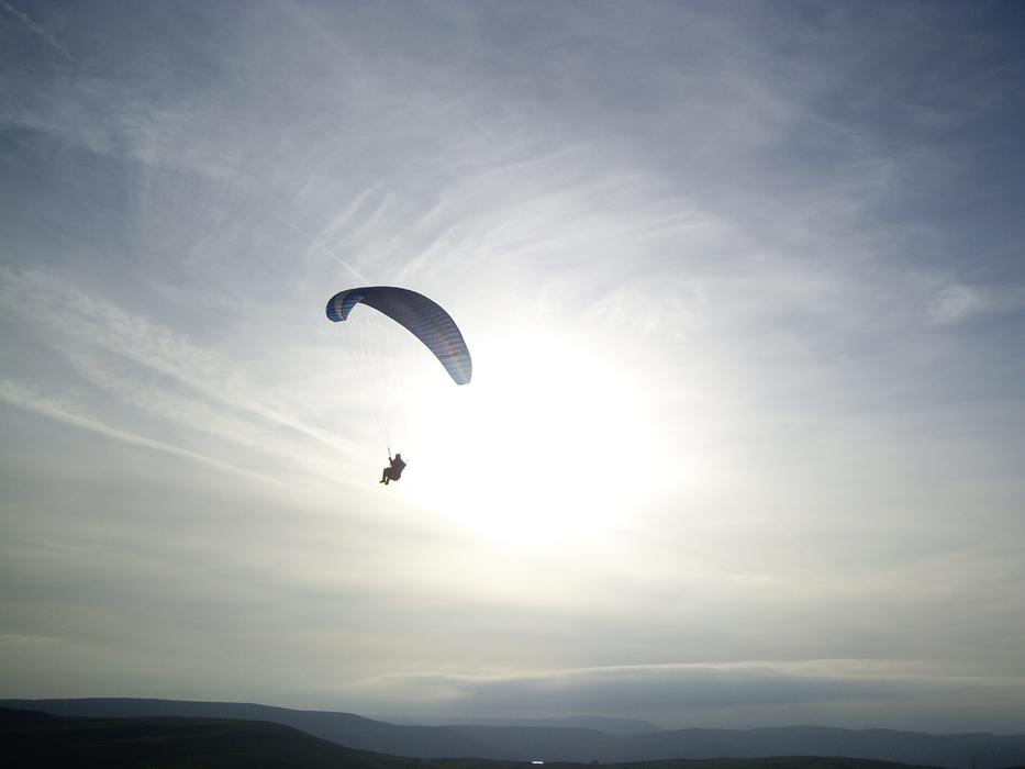 Paragliding, person Flying in sky at dusk