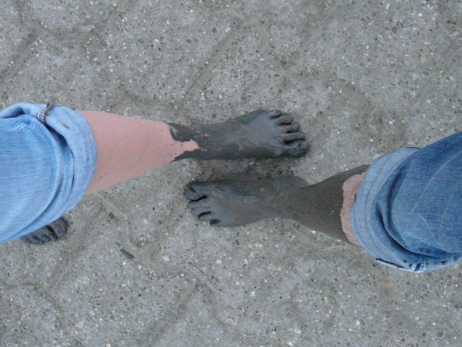 People feet in the clay