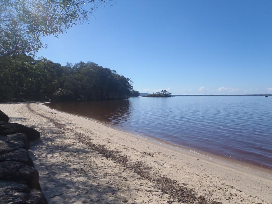 beach with cozy lake