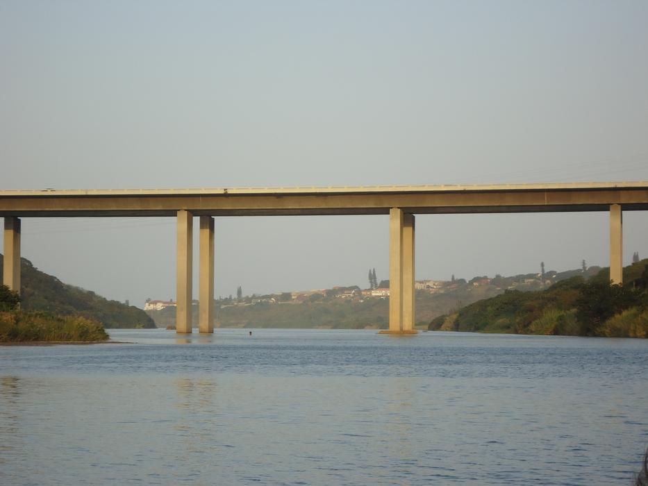 long yellow bridge with the sea