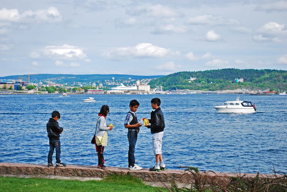friends play by the water