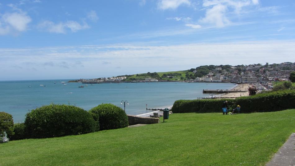 seas with a green field nearby