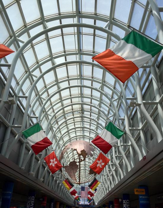 different flags on a glass roof background