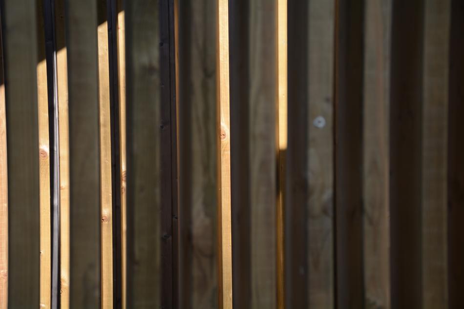 wooden fence with a sun