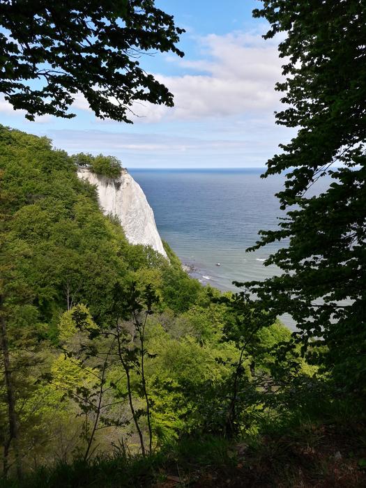 green mountain by the ocean
