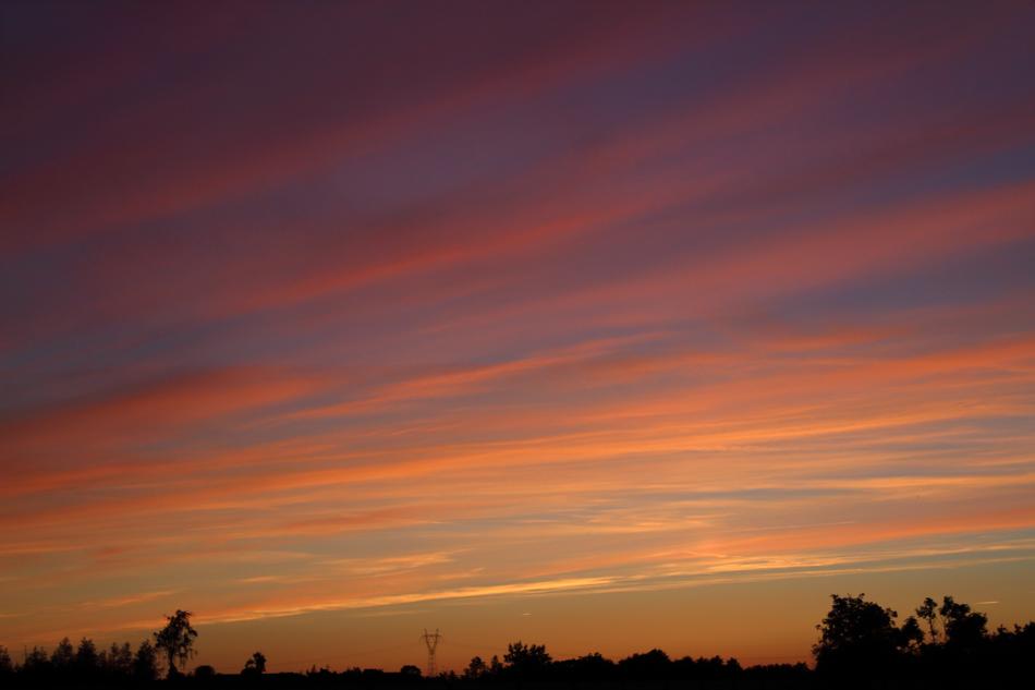 a beautiful sunset with a silhouette of trees