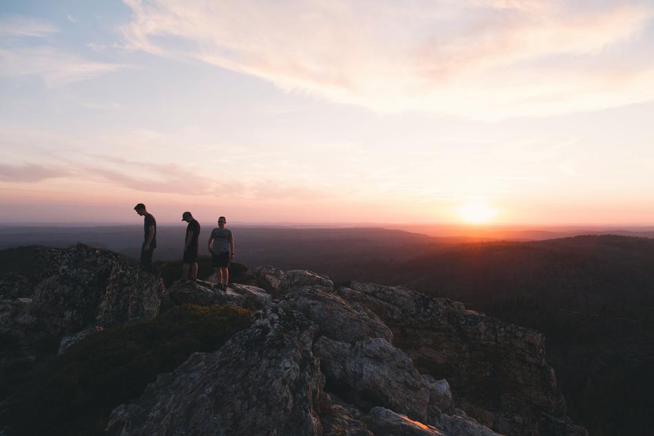 sunset on the mountains with people