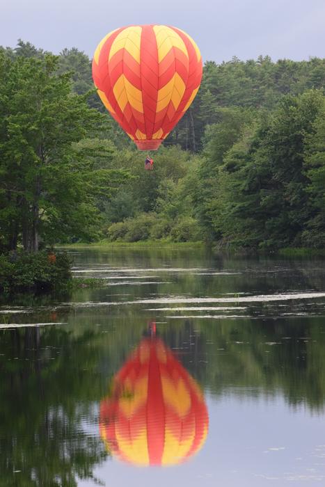 orange balloon by the lake