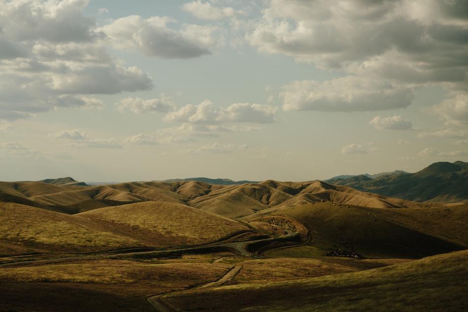 green hills with clouds
