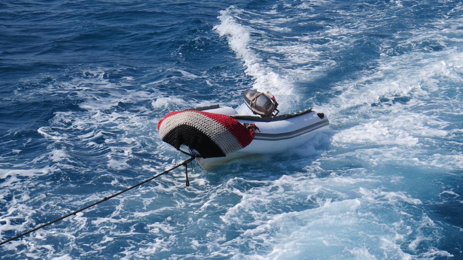 a boat on a rope in the sea