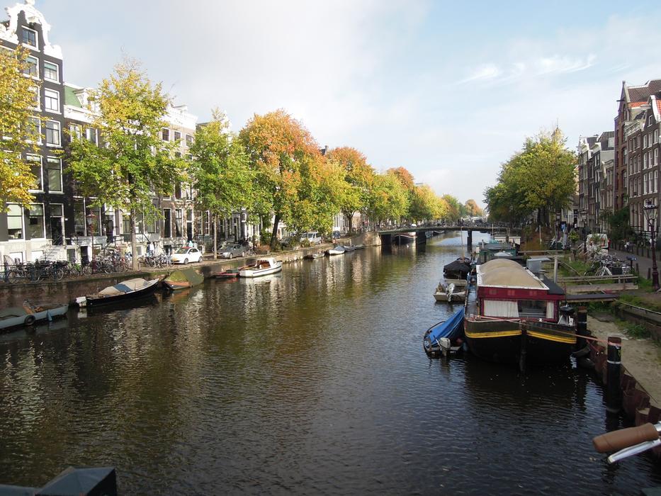 a boat in a canal in the city