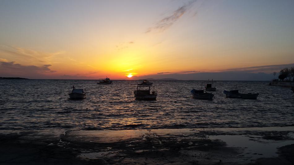 sunset by the sea in boats