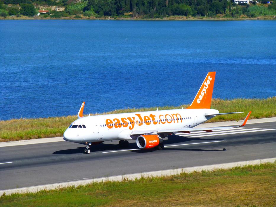 airplane on the road by the sea