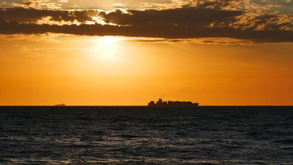 the burning sun over the calm sea