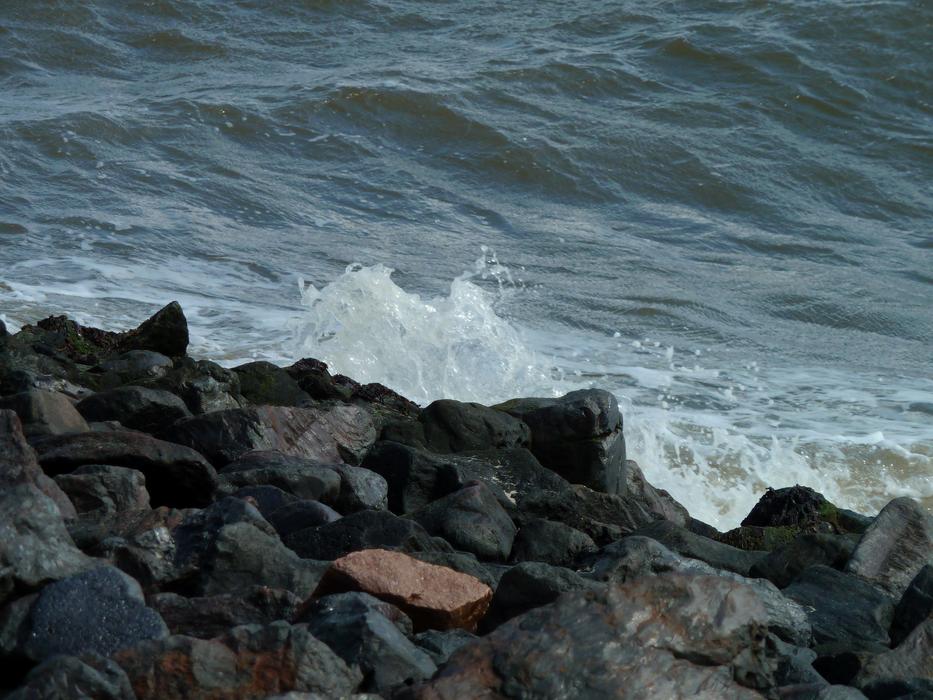 stone beach with a beautiful sea