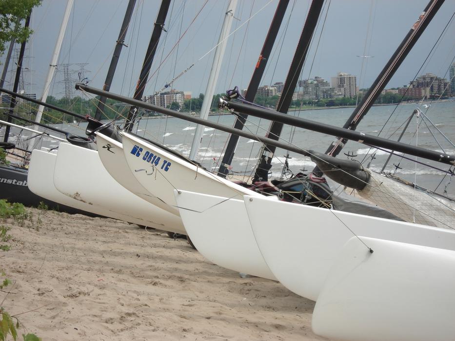 white boats on hot sand