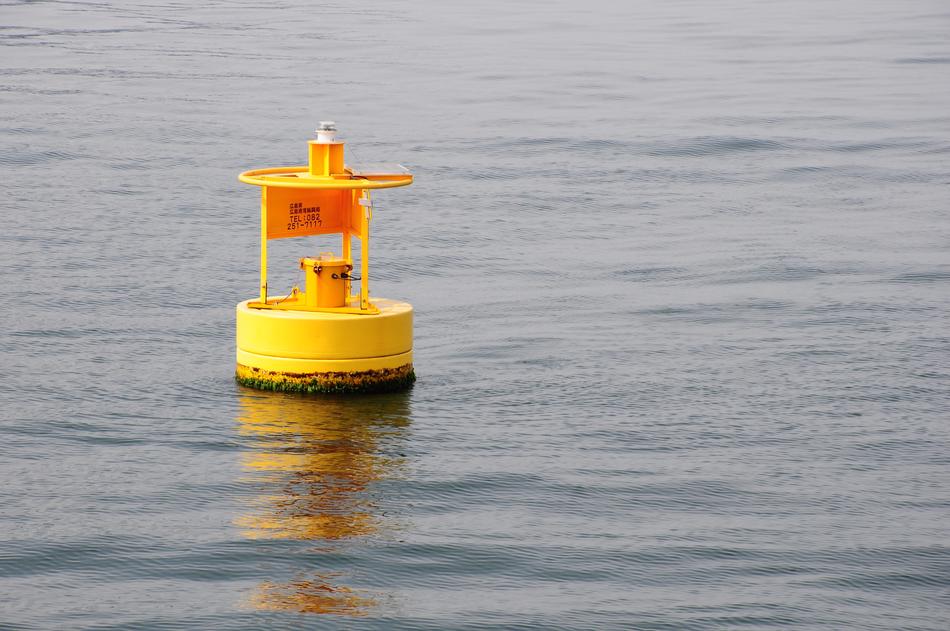 yellow buoy at sea