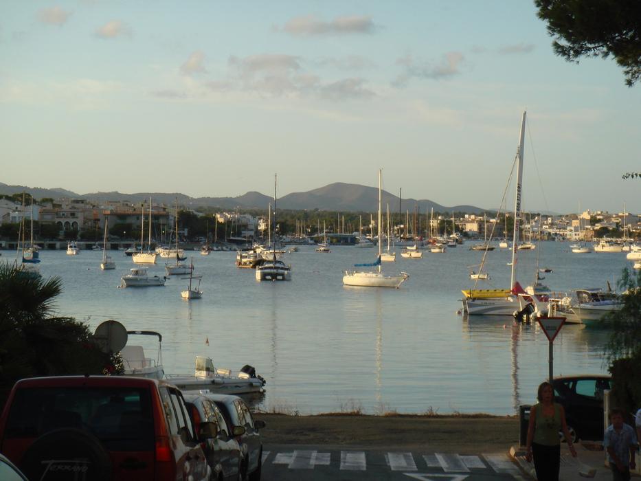 boats by the sea with clouds