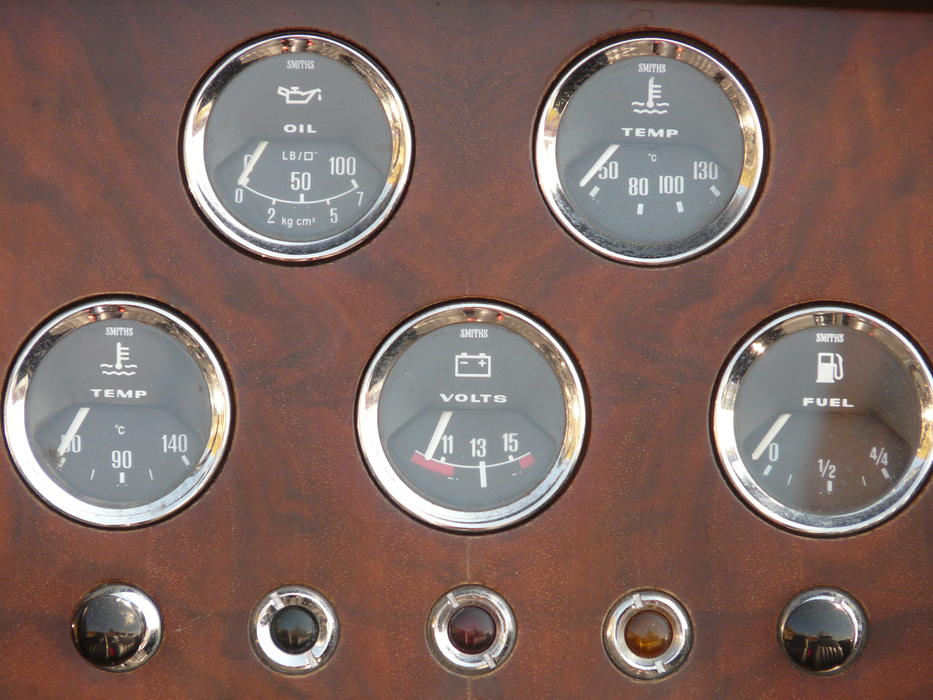 buttons and gauges on vintage dashboard