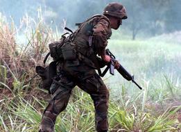 strong Military Soldier on meadow