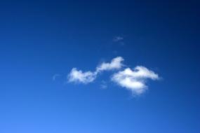 two white clouds in the blue sky