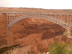 Glen Canyon Dam Bridge is a steel arch bridge in Coconino County, Arizona