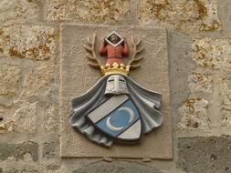 fresco with coat of arms on the castle wall