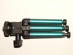 black green camera tripod