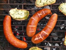 bread and sausages on grill