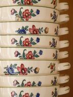 many porcelain bowls with floral print