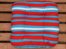 striped pillow on the garden bench