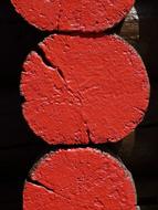 red paint on logs
