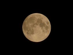 photo of the night moon against the black sky