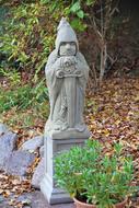 photo of stone sculpture in an autumn park
