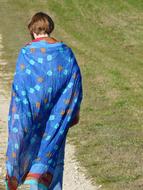man on a walk in a long cape