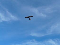 flying small aircraft in the sky