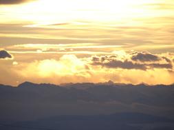 clouds over alpine mountains in winter