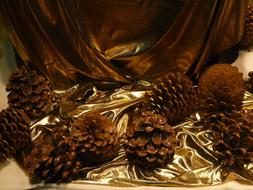 Pine Cones on golden tissue, Christmas Decoration