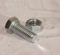 screw and bolt on a marble table