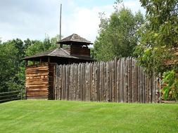 old wooden fence of the fort among nature